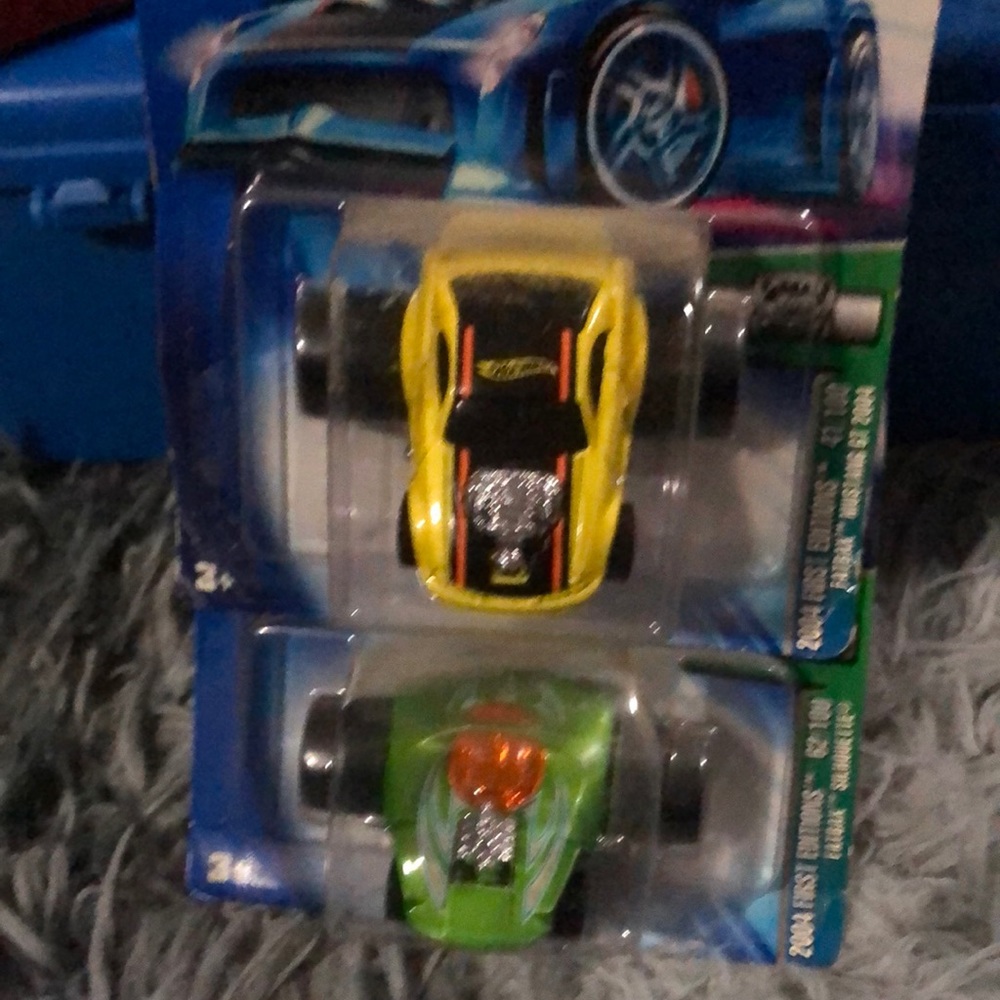 2 big wheeled Hot Wheels cars NIB